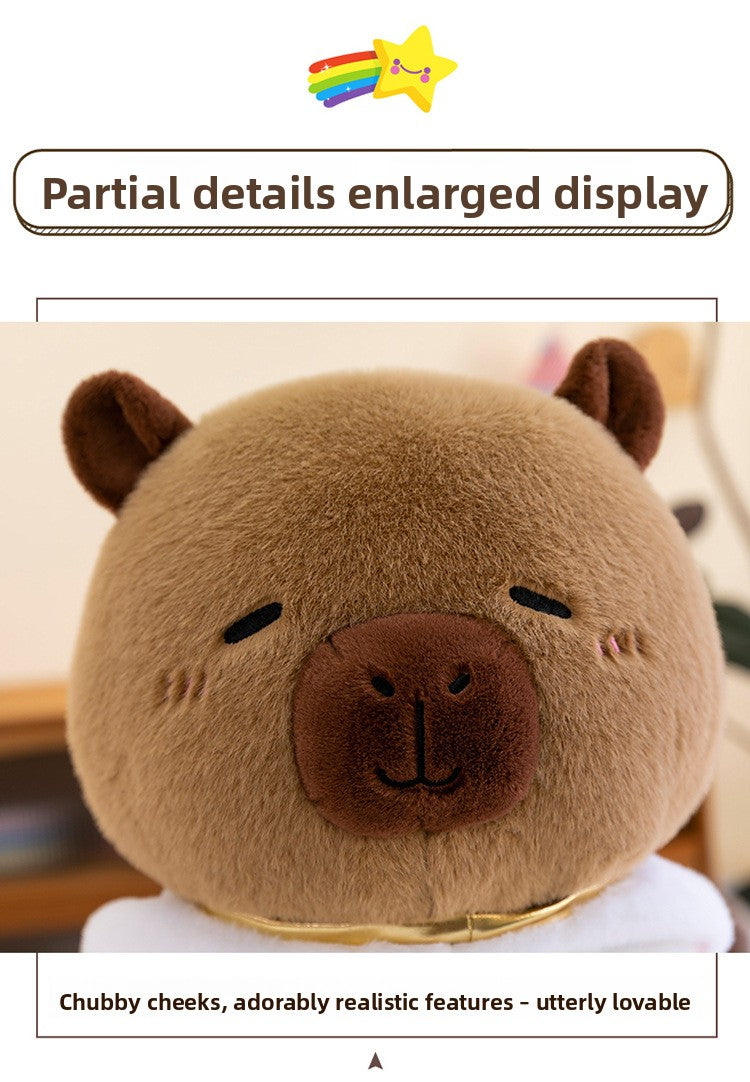 Close up view of the cute sleeping face and chubby cheeks on the alien capybara stuffed animal