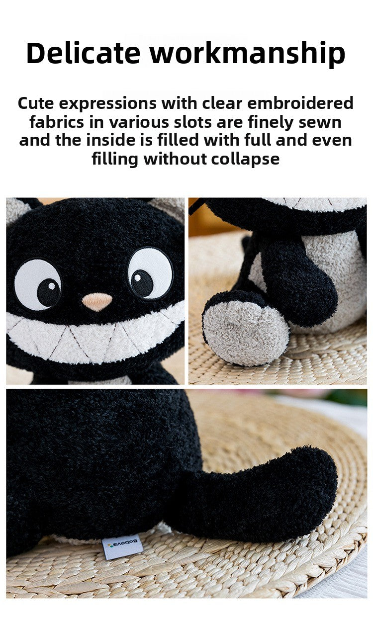 Detailed view of delicate workmanship, clear embroidery, and stitching of the black and white cat plush toy

