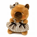 Capybara bag charm with plaid dress and bow, cute plush stuffed figure for handbag and backpack decor, white background