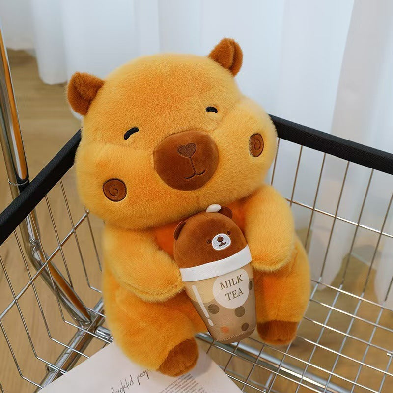 Kawaii orange bubble tea capybara stuffed animal sitting inside a metal shopping cart