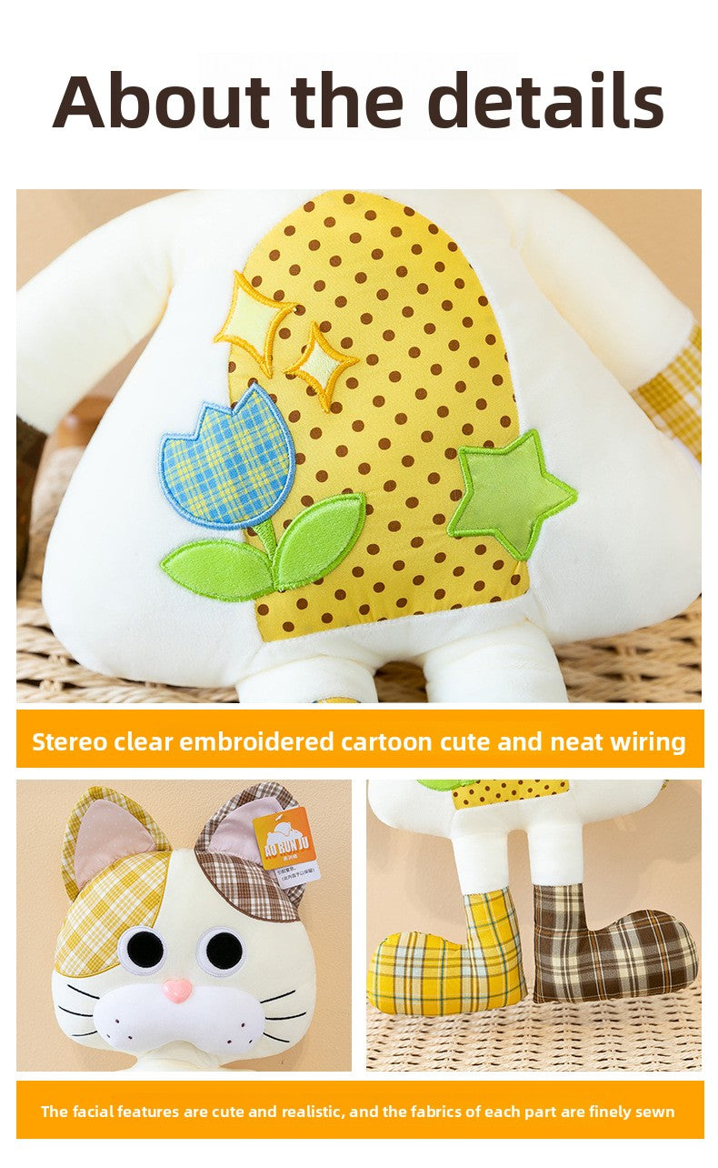 Detailed macro shot of the cartoon tulip embroidery and neat stitching on the patchwork cat plush