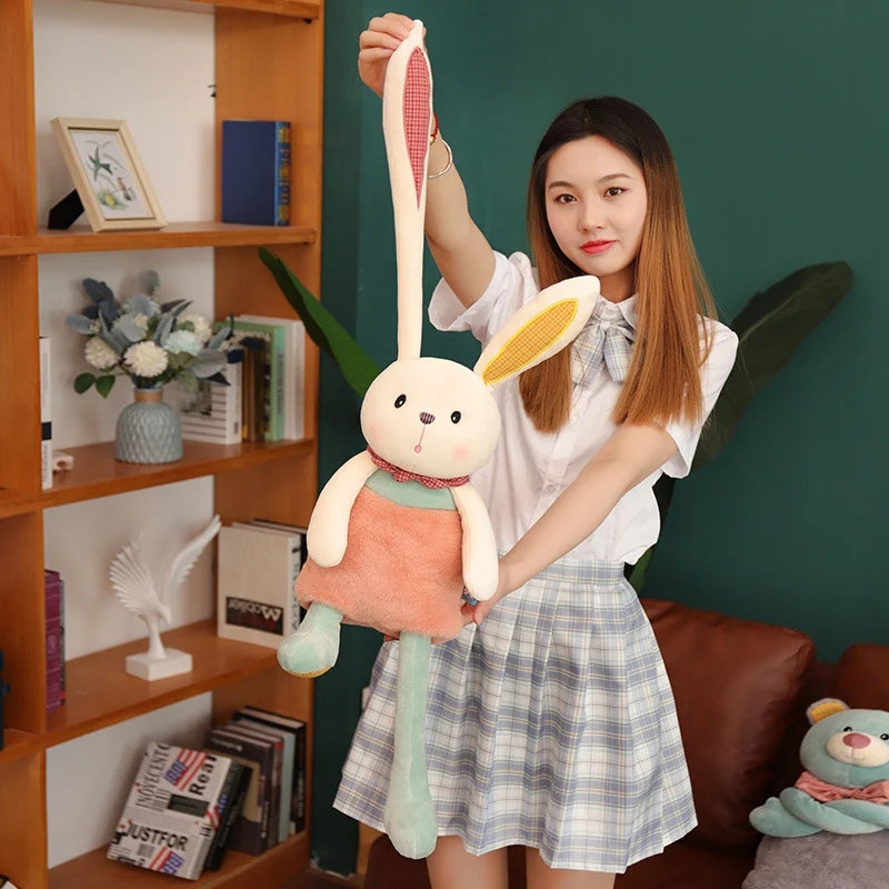 Pull & Stretch stuffed bunny | bunny plush, girl demonstrating pullable long ear rabbit plush